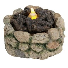 a candle that is sitting in some rocks