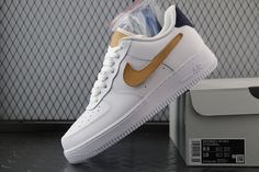 Elevate your everyday style with these classic-inspired Nike Air Force 1 Low sneakers. A distinctive tan Swoosh complements the crisp white leather upper, creating a subtle yet sophisticated contrast. The navy blue heel tab adds a touch of understated elegance, completing the refined look. These sneakers are perfect for those seeking a timeless, versatile shoe with a unique twist. Casual Nike Air Force 1 White With Contrast Sole, Casual Nike Air Force 1 With Contrast Sole, Classic Nike Air Force 1 With Gum Sole, White Leather Nike Air Force 1 With Contrast Sole, Nike Air Force 1 Classic Leather With Gum Sole, Nike Air Force 1 White Leather With Contrast Sole, Cream Nike Air Force 1 Low-top For Streetwear, Modern Luxury Low-top Nike Air Force 1, Luxury Low-top Nike Air Force 1