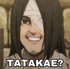 a man with long black hair smiling at the camera and texting that says, tataka?