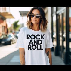 Rock and Roll Shirt, Rock and Roll Graphic Tee T-Shirt, Rock and Roll Music Lover Tshirt 100% Cotton Black Gray White Graphic Tee Thank you for shopping with us! HOW TO PLACE ORDER:   1. Check photos for size chart & color options 2. Use the drop-down menus to select your size and color   3. Select "Add to cart" - come back and repeat this process for each additional color/size variation desired  SHIRT SIZING Please note that these shirts are unisex size - so they are not women's fitted shirts. Summer Rock T-shirt With Band Logo, Rock And Roll T-shirt With Band Logo For Summer, Rocker T-shirt With Band Logo, Summer Rock Style T-shirt For Streetwear, Rock And Roll Crew Neck T-shirt With Screen Print, Rock And Roll Style T-shirt For Summer Streetwear, Rock And Roll T-shirt With Text Print, Rock And Roll Screen Print Crew Neck T-shirt, Rock And Roll Band Logo T-shirt For Summer