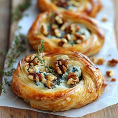 three pastry rolls with blue cheese and walnuts