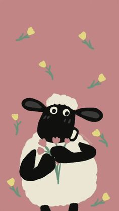 a black and white sheep holding a flower