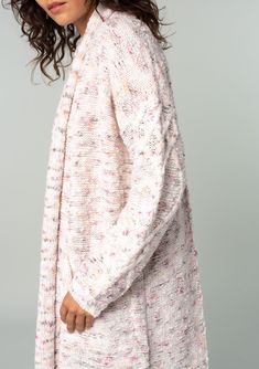 An ultra-cozy long shawl cardigan spun from a berry pink speckled knit. Speckled Oversize fit Long sleeve with cable knit accent Long duster length Shawl collar Side patch pockets Open front Cable knit accent along the back Bohemian long cardigan Laid-back and slouchy yet effortlessly polished, this ultra-soft duster cardigan is knit from a berry pink speckled yarn. Featuring classic cable knit details along the back and essential side pockets. The shawl collar adds warmth and coziness. Model is Textured Knit Cozy Outerwear, Cozy Cable Knit Relaxed Fit Cardigan, Cozy Fit Textured Knit Outerwear, Cozy Cable Knit Sweater Coat For Loungewear, Pink Relaxed Fit Cardigan For Fall, Relaxed Fit Pink Cardigan For Fall, Pink Long Sleeve Relaxed Fit Cardigan, Relaxed Fit Long Sleeve Pink Cardigan, Cozy Pink Knitted Sweater Coat