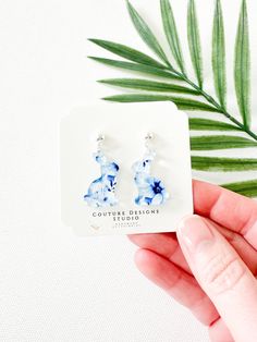 These little Blue and White Floral Easter Bunny Earrings are just so pretty and such a fun way to celebrate Easter.  They are are made using a blue and white floral french toile inspired acrylic little Easter Bunnies. The total length of these earrings measure approximately 1.25 inches tall and .75 inches wide. These earrings are set using your choice of Stainless Steel Silver or Gold Ball Posts OR lead free and nickel free ear wires (suitable for even sensitive ears) in a Gold or Silver finish. Elegant Blue Resin Earrings, Easter Bunny Earrings, Easter Earrings, French Toile, Bunny Earrings, Easter Bunnies, Blue And White Floral, Bunny Easter, Earring Cards