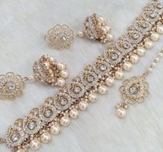 an assortment of pearls and diamond jewelry