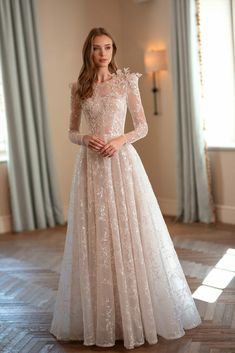 a woman in a wedding dress standing on the floor with her hands on her hips