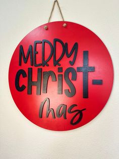 a red sign that says merry christmas and has black lettering on the bottom of it