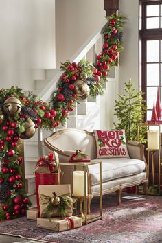 christmas decorations on the stairs in a living room