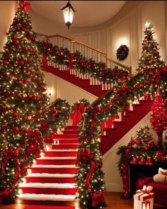 christmas tree decorated with red and green garlands on the bannister, stairs