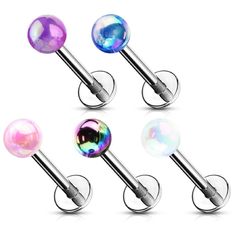 four different colored glass balls are attached to the barbells, and each has a circular