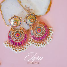 Adorn into the extravagant fusion of grace and royalty! Paint yourself in luscious shades of nauratan stones enhanced by pearl moti hanging with a classic embodiment of ravishing design radiating elegant femininity. Approximate earrings length is 4". Gold-plated on high-quality brass as base metal. In-stock & ready-to-ship. *Please Note: The multi-colored beadwork might be slightly varying in pattern. We use faux stones and beads in all of our jewelry. Unique Gift Cards, Create Words, Faux Stone, Base Metal, Free Giveaway, Picture Perfect, Multi Colored, Bead Work, Beautiful Jewelry