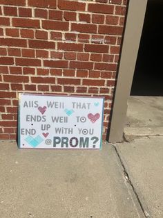 a sign on the side of a building that says, alls well that end went to end with you prom?