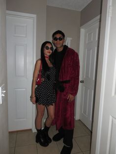 a man and woman dressed up in costumes