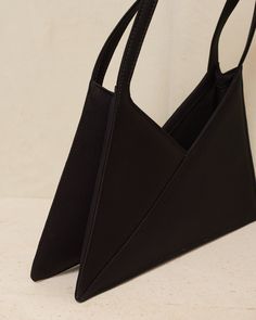 Accordion baguette bag by MM6 Maison Margiela. A reinterpreted style based on Maison Margiela's signature triangle bag range. Crafted with sleek satin to a concise, angular silhouette. Accordion gusset allows for deceptively spacious capacity. 50% Cotton, 50% Polyester.Made in Italy. Designer Square Baguette Bag In Black, Designer Black Square Baguette Bag, Modern Evening Baguette Bag With Removable Pouch, Modern Top Handle Baguette Bag For Evening, Modern Evening Baguette Bag With Top Handle, Modern Evening Baguette Bag With Top Carry Handle, Modern Square Baguette Evening Bag, Modern Formal Baguette Tote Bag, Modern Evening Bag