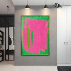 an abstract painting hangs on the wall in a modern living room with white floors and gray walls