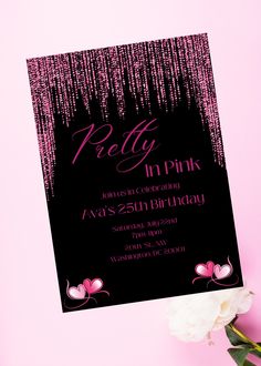 a black and pink birthday party card with streamers on the front, white flowers in the background