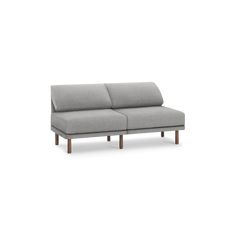 a gray couch sitting on top of a white floor