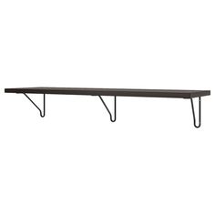 a black shelf with two metal brackets on it