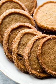 a white plate topped with cookies on top of a table