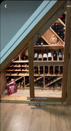 there is a wine rack under the stairs