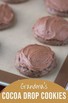 chocolate cookies on a cookie sheet with the words grandma's cocoa drop cookies over it