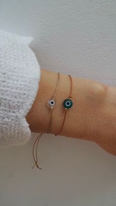 Evil Eye Bracelet. Evil Eye Cord Bracelet. Evil Eye String | Etsy Cyprus Adjustable Dainty Evil Eye Bracelet, Minimalist Adjustable Beaded Bracelets With Evil Eye, Adjustable Evil Eye Beaded Bracelets For Everyday, Adjustable Dainty Evil Eye Jewelry, Handmade Minimalist Evil Eye Bracelet, Adjustable Evil Eye Jewelry For Everyday, Dainty Adjustable Evil Eye Bracelet, Bohemian Adjustable Eye-shaped Jewelry, Adjustable Bohemian Eye-shaped Jewelry