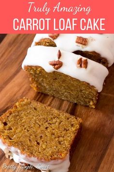 two slices of carrot loaf cake with white frosting and pecans in the background