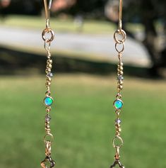 One of a kind designs. 4 inches long. Handmade with all gold filled components. High quality, small Blue Opal connectors set in 14KGF with smoky crystals. 14K Gold filled disks and "balloon" hook posts. 14KGF flower design chains, jumps rings and flats disk on ends.  These Opals are tiny, but mighty! They have amazing fire to them and if they turn, it's okay, they are double sided!! Gold Hypoallergenic Opal Jewelry, Hypoallergenic Gold Opal Jewelry, Adjustable Gold Jewelry With Ethiopian Opal, Adjustable Gold Ethiopian Opal Jewelry, Gold Ethiopian Opal Earrings For Gift, Teardrop Opal Earrings In Gold, One Of A Kind Gold Teardrop Earrings, Gold Opal Drop Earrings, Smoky Crystal