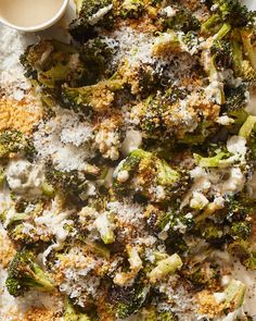 broccoli covered in white sauce and sprinkled with parmesan cheese