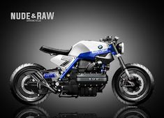 a blue and white motorcycle is shown on a black background with the words mude & raw