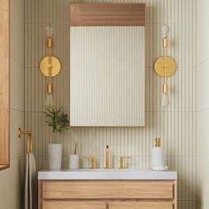 a bathroom with a sink, mirror and towel rack on the wall next to it