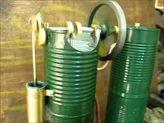 two large green barrels sitting next to each other