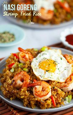 fried rice with shrimp and egg served on a plate