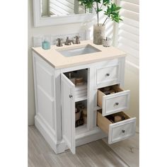 a bathroom vanity with two drawers and a sink