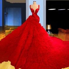 a red dress is on display in a room