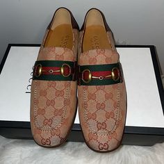 Authentic Gucci Men Loafers Moccasins Brand New Item# 546223 Size- 6+ Color: Brown And Beige Features: Unisex (Men's 6+, Equivalent To Women's Size 9 Us) Leather And Canvas Material, Can Be Worn As Loafer Or Folds Down As Mule. Double Gg Signature Print Throughout. Solid Wood Heel, Approximately 2 Inch * Women -Pairs Well With Gucci Red Re(Belle) See This Listings In My Closet Designer Brown Slip-on Loafers, Brown Gucci Slip-on Loafers, Designer Slip-on Moccasins With Rubber Sole, Luxury Brown Gucci Loafers, Gucci Brown Shoes With Leather Sole, Designer Moccasins With Leather Sole And Round Toe, Designer Slip-on Moccasins With Leather Sole, Gucci Brown Loafers With Rubber Sole, Gucci Slip-on Loafers With Round Toe