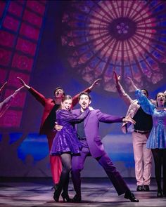 a group of people standing on top of a stage