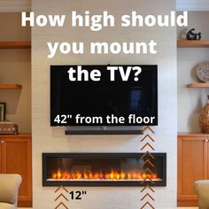 a tv mounted on the wall above a fireplace with text overlay that reads, how high should you mount the tv? 42 from the floor