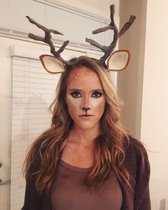 a woman with deer antlers on her head