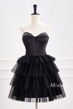 Strapless Black A-Line Tiered Tulle Homecoming Dress Black Homecoming Evening Dress With Sweetheart Neckline, Black Tulle Corset Dress For Evening, Black Mini Dress For Wedding And Prom Season, Black Tulle Mini Dress For Prom Season, Black Strapless Tulle Evening Dress, Black Tulle Strapless Dress For Wedding, Black Tulle Corset Dress With Ruffles, Black Tulle Dress With Sweetheart Neckline, Black Sleeveless Tulle Corset Dress