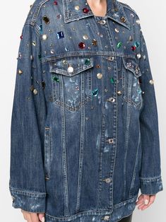 Blue cotton embellished denim jacket from DOLCE & GABBANA featuring rhinestone embellishment, spread collar, two chest flap pockets, front button fastening and long sleeves. | Dolce & Gabbana Embellished Denim Jacket Designer Long Sleeve Denim Jacket With Button Closure, Designer Denim Long Sleeve Outerwear, Embellished Long Sleeve Denim Jacket For Fall, Long Sleeve Embellished Denim Jacket For Fall, Blue Denim Embellished Outerwear, Trendy Blue Embellished Outerwear, Trendy Embellished Blue Outerwear, Blue Embellished Denim Outerwear, Embellished Blue Denim Outerwear