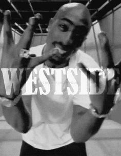 a man is holding his hands up in front of him with the words westside on it