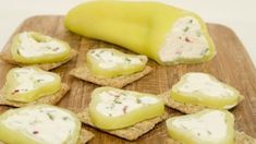 crackers with cream cheese and herbs on them