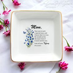 a plate with flowers and a verse on it