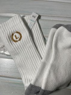 NKDs offering: MEN'S Black or White Wheat Crest + TNR 1 Initial Monogrammed Socks  Are these the must-have? Here I have "a pair" of very classy CASUAL ribbed top black or white men's monogrammed socks.  They have a very wonderful monogram in the color of your choice. →For teen boys and men. →Monograms can be on one or both socks. This monogram is placed at the TOP of the sock.  If you would like it placed lower by the ankle, there will be a charge of $1 ADDED PER SOCK to RELOCATE. Purchase this Wedding Party Groomsmen, Bride Headband, Embroidered Initials, Embroidered Gifts, White Socks, Classy Casual, White Sock, Font Styles, Casual Socks