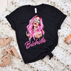 Karol G Pink Hair Shirt, La Bichota Shirt, Reggaeton Shirt Karol G Pink Hair, Shirt Hair, Basketball Shirts, Blackbird, Hottest Trends, Black Bird, Pink Hair, The United States, Shirt Designs