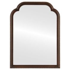 a large mirror with an arch shaped frame on the top and bottom, against a white background