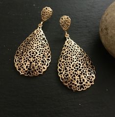 "These are lovely dangling chandelier style earrings in gold .an vintage style gold  teardrop dangle earrings  These are an Indian earrings that could be worn by both traditional and an western attire. This Unique jewellery is designed and crafted at Abi CreatioNzs Abi CreatioNzs is the place for anyone who Is in lookout for a latest trend with an ethnic touch.  We at Abi CreatioNzs offers a great range of Indian Ethnic jewellery's. We are strongly committed to  providing our customers  some uniquely handcrafted products with utmost satisfaction.  Note: The product shipped will be same as shown in the picture however, actual colours may vary slightly from those shown due to lighting in the photography Pls note The shades of gold / silver  may vary slightly. We do not accept any returns or Gold Plated Teardrop Earrings For Party, Gold Chandelier Earrings With Intricate Design For Party, Vintage Gold Long Drop Earrings, Bohemian Teardrop Yellow Gold Earrings, Bohemian Yellow Gold Teardrop Earrings, Rose Gold Teardrop Earrings, Elegant Gold Teardrop Chandelier Earrings, Yellow Gold Teardrop Chandelier Earrings, Gold Chandelier Earrings With Intricate Dangle Design