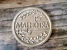 a wooden sign that says the mahlottra family on it's side