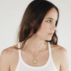 Our Boho necklace was inspired by ancient cultures and modern forms. All pieces of jewelry are made of sustainable brass, which acquires a unique patina over time. The jewelry is as light as a feather and fits your everyday outfit or a special occasion. Chain lengths: S: 42 cm / Meter: 45 cm / L: 50 cm Info: Brass is an alloy of copper and zinc. It is a very compatible jewelry material for most people. Brass develops a typical patina over time. Contact with water, perfume and other substances ca Festival Medallion Necklace With Coin Pendant, Festival Coin Pendant Medallion Necklace, Everyday Brass Jewelry With Coin Pendant, Medallion Necklace With Coin Pendant For Festivals, Brass Medallion Charm Necklaces, Brass Amulet Locket Coin Necklace, Brass Amulet Coin Necklace With Locket, Everyday Brass Coin Pendant Necklaces, Bronze Brass Coin Pendant Necklace